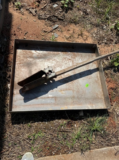Metal pan and broken post hole digger