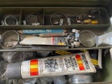 Metal toolbox with grease and hose clamps and misc items
