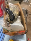 Box cutter, hinges, light bulb, and door pulls