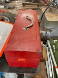 Red toolbox with zip ties, wood handles, tape and more
