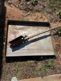 Metal pan and broken post hole digger