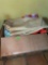 Box with blanket, sweater, shower curtain, bathroom rug and towels