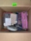 Box with misc items. Nail clippers, cuticle cutters, electronic card games, hearing aid batteries,