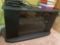 Swiveling tv stand with glass door, see photos for measurements. Contents on top not included, bring