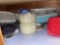 bottom shelf with plastic containers and other kitchen items