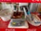 Crock pot dish, cake pan, cactus dish, oven mitts, cutting boards, squigee spray bottle, platter and