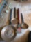 On the core clock, ladle cake pan and a barbecue grill spatula