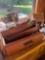 cheese, grater, wooden decor, measuring cups, and wooden drawers