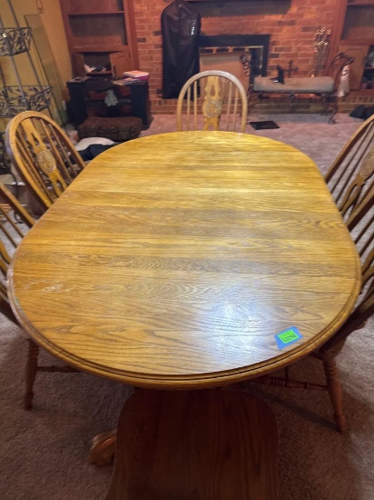 Wood dining room table with six chairs
