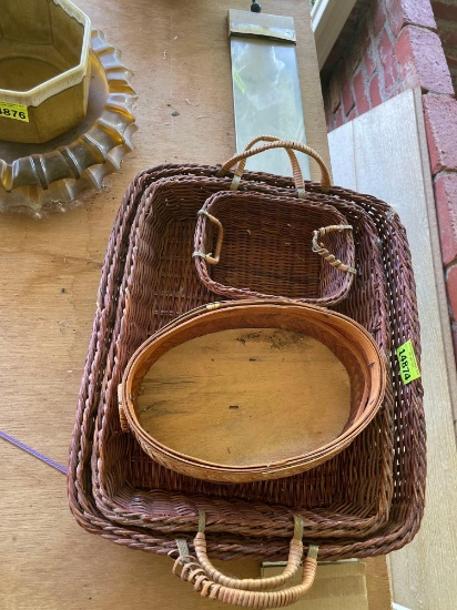 Wicker baskets and small decor mirror on back porch