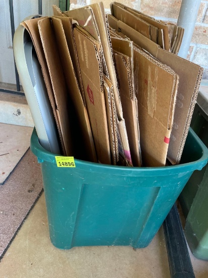 Storage tote with boxes on back porch