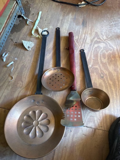 On the core clock, ladle cake pan and a barbecue grill spatula