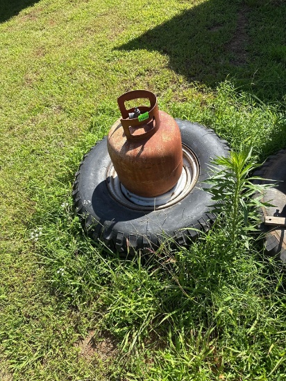 gas can tires hose rope and wood