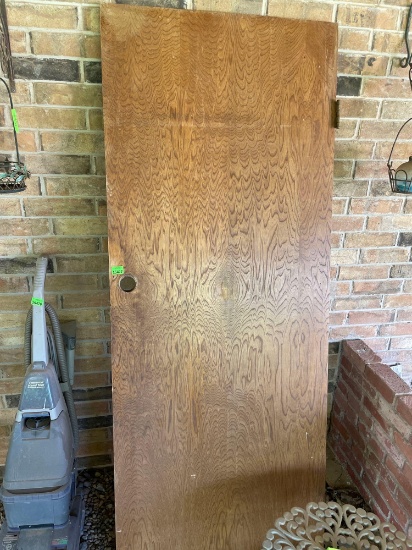 Wooden door on back porch