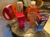 Wood decorative barrel, mirror, old spice, ace bandage wraps, glass lid, liquid soap, and a