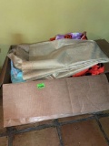 Box with blanket, sweater, shower curtain, bathroom rug and towels