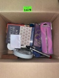 Box with misc items. Nail clippers, cuticle cutters, electronic card games, hearing aid batteries,