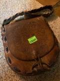 leather bag, with engraved sun