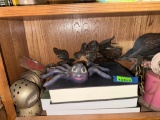 candle greenery, wall decor, spider decor, books, candle holders