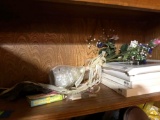 Books, picture frames, floors, frog decor
