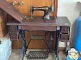 SingerTreadle sewing machine in sewing table