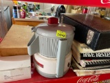 Acme juicerator, birdhouse drawer pulls, grater, angel ornaments, cook books and more