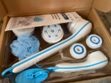 Spa brush set, bag of bandage wraps, disposable masks, and wall brackets and more