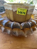 2 amber colored glass dishes and gold ceramic dish on back porch