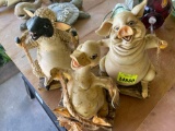 Pig, duck, and sheep swinging decor on back porch