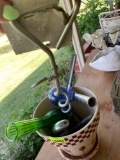 Plant pot with misc items on back porch