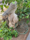 Concrete pelican decor (bring help to load) and planter on back porch
