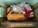 Christmas decor in storage tote on back porch
