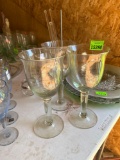 3 tall wine glasses with stirrers and mixing spoon