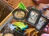picture frames, clock, leaf decor and glove