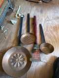 On the core clock, ladle cake pan and a barbecue grill spatula