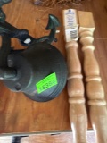 Metal outdoor bell and two wood table legs