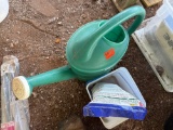 watering can and garden feed