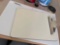 Mouse pads, clipboard, graphic paper, CDs envelopes, and a stapler