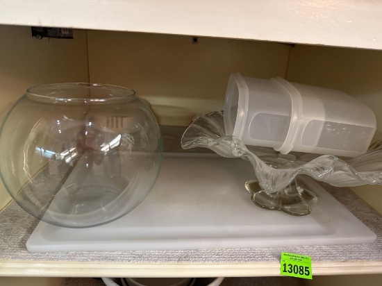 Two glass bowls, three Tupperware containers and a cutting board