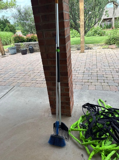water hoses, broom and rake