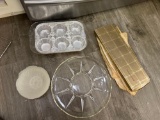 Serpent tray, muffin pans, knives, and a sharpener and a fork with deer handles