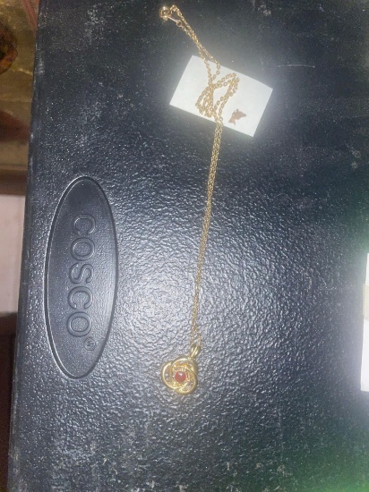 Ladies Necklace with red stone in center