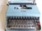 Blue Lettera 22 typewriter with case