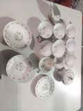 old tea set/ 10 cups, creamer bowl, sugar bowl, 4 plates for cups, 4 small bowls, and 2 plates