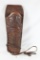 One tooled brown leather single band right handed western holster. Used in good condition.