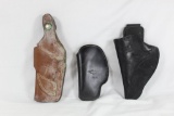 Bag of three leather holster. One left handed and two right handed. One Bianchi, one DeSantis and