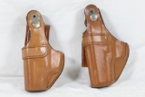 Two brown leather Bianchi left handed holsters. One for S&W CS45 and one for Taurus PT111/PT140. As