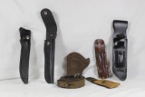 Bag of a number of leather items. Four leather knife sheaths for fixed blade knives, one leather