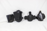 Bag of holsters. One leather ankle holster, One padded nylon ankle holster, right handed belt