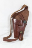 One USCG brown leather shoulder holster. Used in good condition.